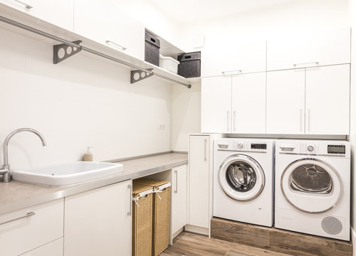 Laundry Room With Washing Machine In Modern House