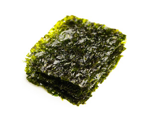 dried nori seaweed laminaria sheets, isolated on white © nikkytok