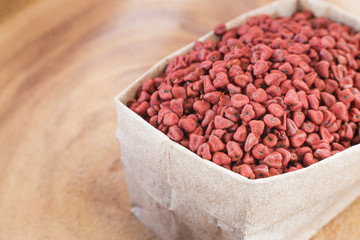 Achiote seeds and powder - Bixa orellana. Top view