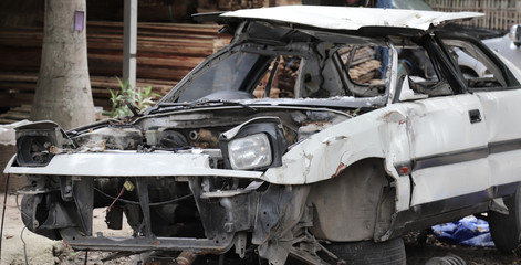 Closeup of front side of a old damaged car.