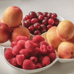 fruit closeup, peach, raspberry, cherry. Vegan snack