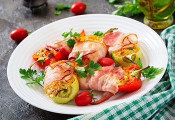 Stuffed peppers with cottage cheese and bacon in plate on the  table. Balkan food.
