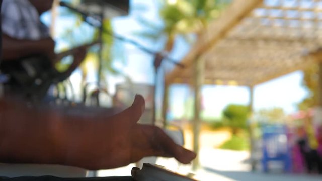 Ethnic drummer playing hand drums