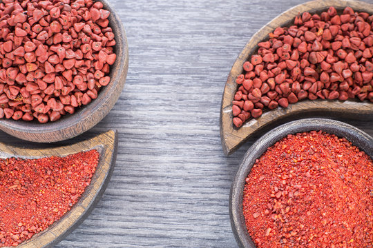 Achiote seeds and powder - Bixa orellana. Top view