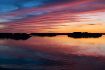 A natural  Dramatic,  blazing   sunset in the Baltic sea. Bright sky and clouds. beautiful seascape as background