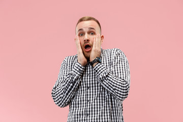 I'm afraid. Fright. Portrait of the scared man. Business man standing isolated on trendy pink studio background. male half-length portrait. Human emotions, facial expression concept.