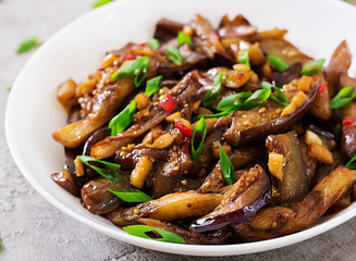 Hot spicy stew eggplant in Korean style with green onion. Aubergine saute. Vegan food