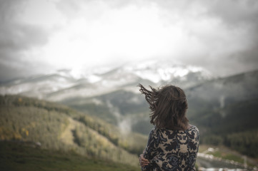 girl in the wind in the mountains