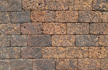 Closeup of old brown stone wall.