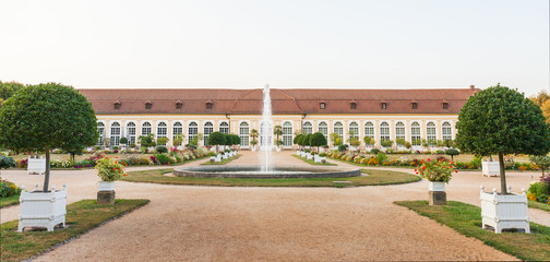 The main building of the Orangery and the fountain in the Central Park of Ansbach, Bavaria Germany