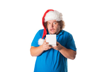 Funny fat man in Santa hat with gifts. Christmas and presents