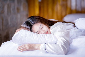 Obraz na płótnie Canvas Beautiful Attractive Asian woman sleep and sweet dream on bed in bedroom in the morning feeling so relax and comfortable,Healthcare Concept