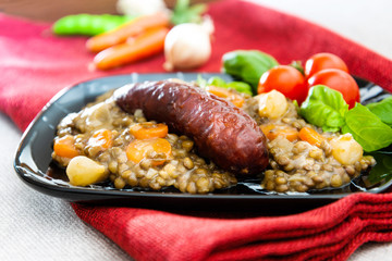 Homemade Sausage Cooked lentils with baby onions and carrots
