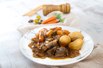 Beef meat stewed with potatoes-Traditional French cuisine Beef Bourguignon potatoes carrots in persillade