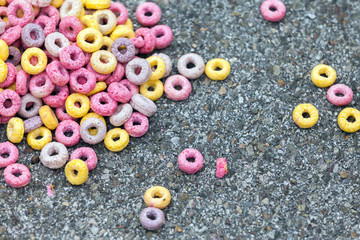 colored, corn Breakfast cereals scattered on the pavement, the road