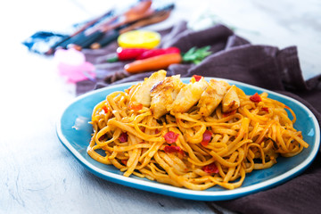 asian food chicken noodles on the table