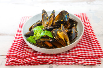Mussel with white wine sauce on table