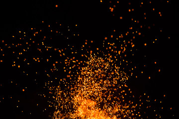 Fire sparks with flames on black background