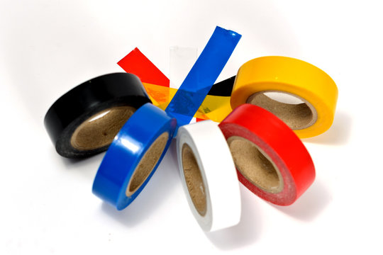 Rolls of colored duct tape on white background
