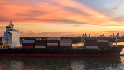 Container ship in export and import business and logistics. Shipping cargo to harbor by crane. Water transport International. Aerial view and top view.