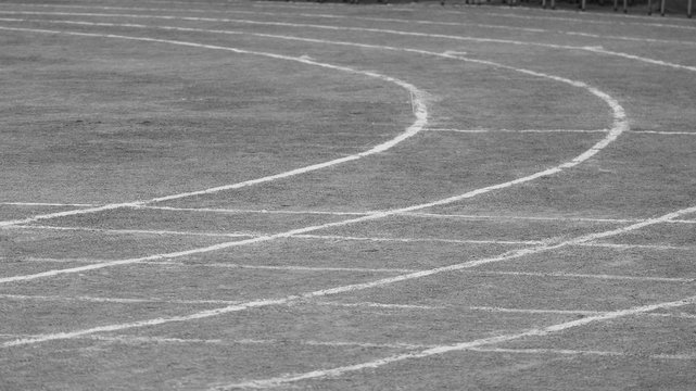 empty white line running track on the sand.