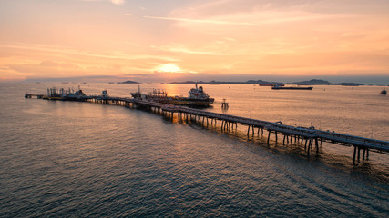 Obraz premium oil tanker, gas tanker in the high sea.Refinery Industry cargo ship,aerial view,Thailand, in import export, LPG,oil refinery, Logistics and transportation with working crane bridge in harbor