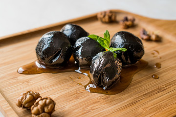 Turkish Dessert Walnut Jam with Mint leaves / Marmalade on Wooden Tray.