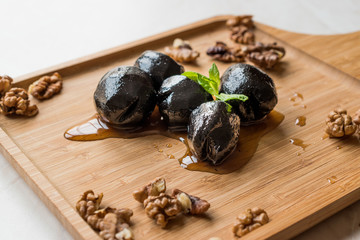 Turkish Dessert Walnut Jam with Mint leaves / Marmalade on Wooden Tray.
