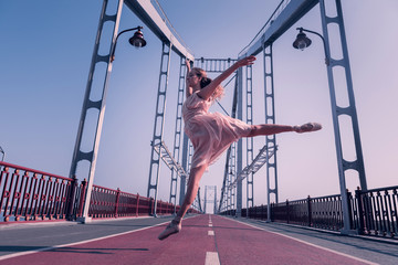 Dance is my life. Nice pleasant woman being involved in the dance while jumping up in the air © Viacheslav Yakobchuk