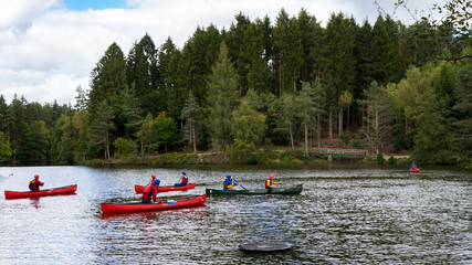 Fototapeta na wymiar People Kayaking in a Lake