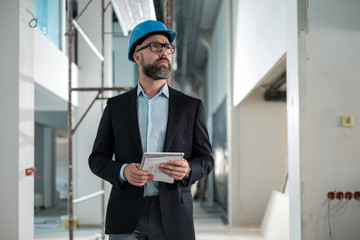 Middle-aged engineer in hardhat