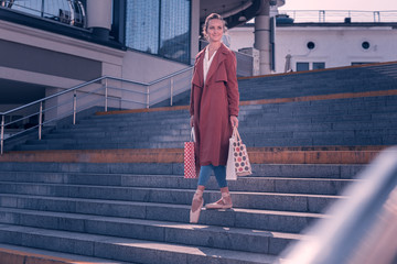 New clothes. Nice happy ballerina holding bags while doing shopping © Viacheslav Yakobchuk