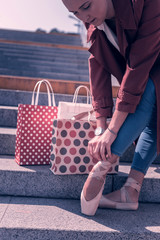 For dancing. Nice young female dancer wearing her new shoes while standing on the stairs © Viacheslav Yakobchuk