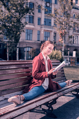 Wonderful day. Delighted cheerful ballerina reading a book in the park while enjoying her weekend © Viacheslav Yakobchuk