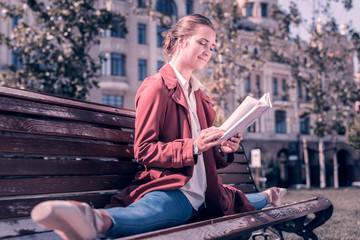 So interesting. Joyful positive ballerina reading an interesting book while doing the splits © Viacheslav Yakobchuk