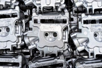 Pile of aluminum automotive parts head cylinder, casting process in the automotive factory