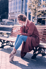 Minute to relax. Beautiful nice woman having a small rest while holding a hamburger © Viacheslav Yakobchuk