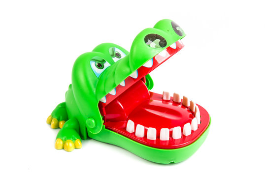 Alligator, green plastic crocodile toy on isolated