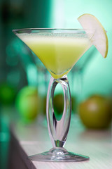 Apple martini cocktail in green