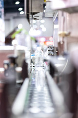 Manufacturing of bottles plastic line, bottle plastic hot blow process transportation raw material by automatic conveyor in the factory