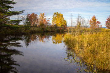 Michigan Autumn Scenic Landscape. Fall foliage reflection in the Hiawatha National Forest in the Upper Peninsula of Michigan.