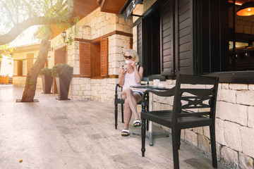 Woman drinking coffee outdoor and enjoying it. Morning awakening ritual