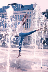 Beautiful location. Professional beautiful ballerina dancing near the historical building while having a performance © Viacheslav Yakobchuk