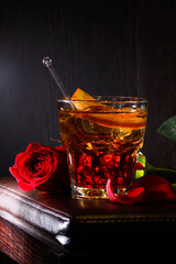 Negroni cocktail with red rose