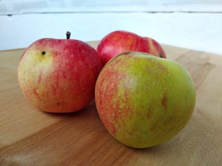 apples on wooden table