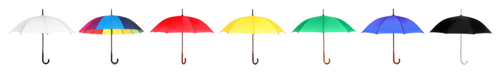 Set with different color umbrellas on white background