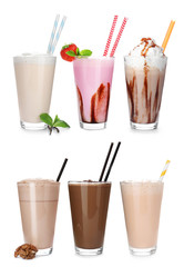 Set with different delicious milk shakes on white background