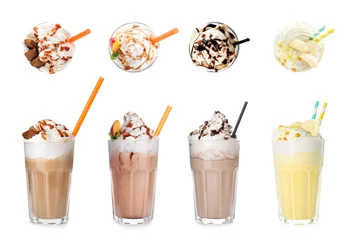 Selbstklebende Fototapeten Set with different delicious milk shakes on white background © New Africa