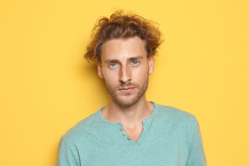 Fototapeta premium Portrait of young man on color background