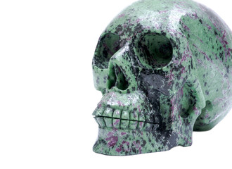 Ruby Zoisite realistic crystal carved skull isolated on white background